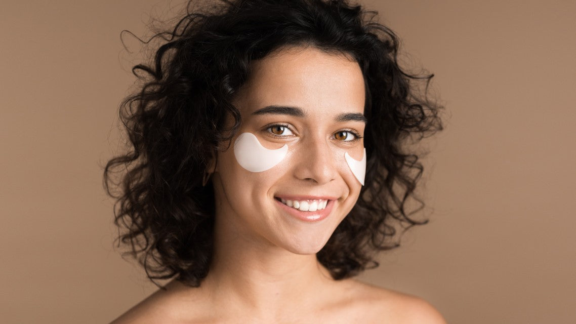 young woman with patches under her eyes